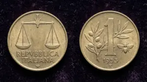 Moneta da 1 lira con ape del 1953, fronte e retro, su sfondo scuro